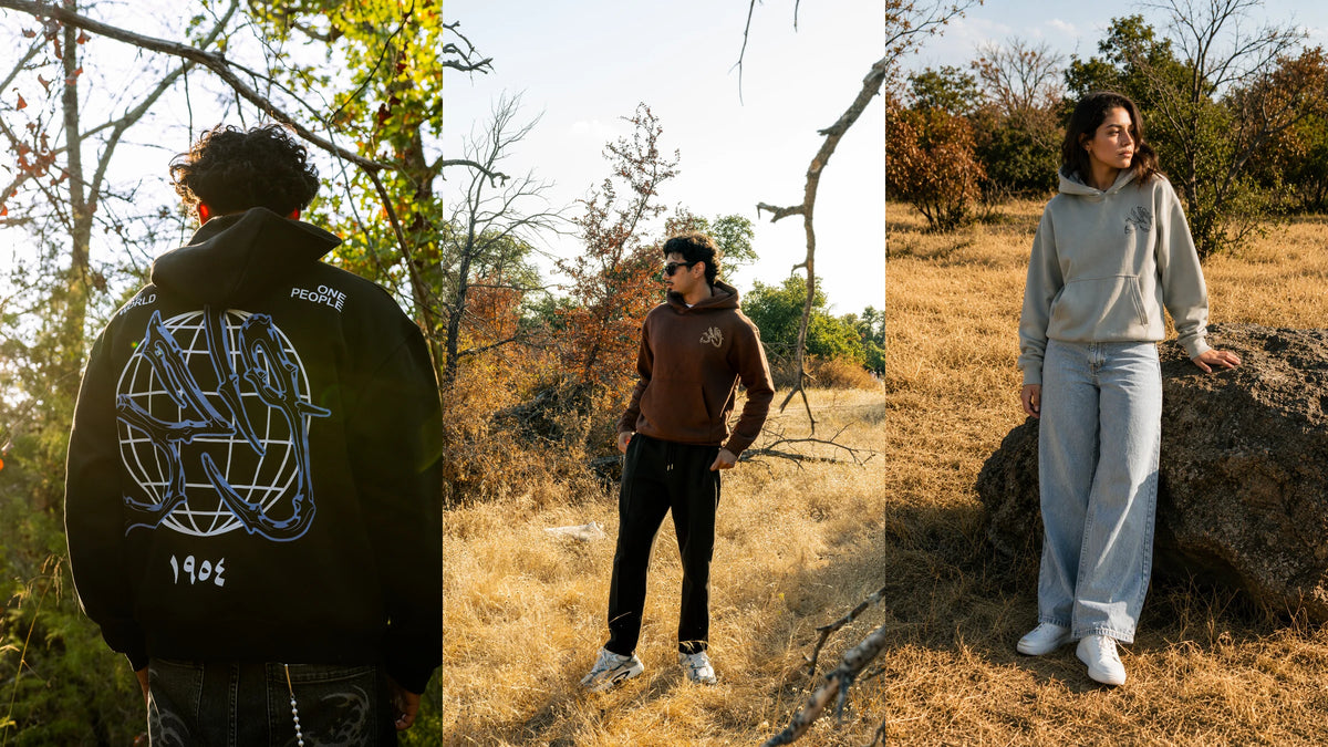 Two men and a woman outdoors wearing Black Forest, Mocha and Gray Wahid hoodies
